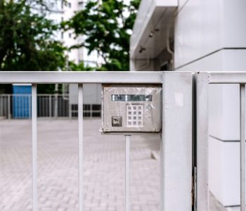 Intercom on the fence of a new building.